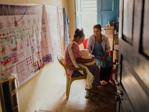 A woman and her infant visit a health post in Nepal