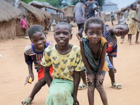 Children pose for the camera in a CAR camp.