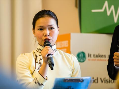 A child speaks at a conference