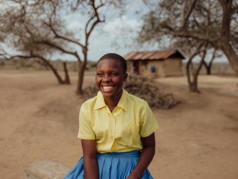 Faith smiles because of school meals