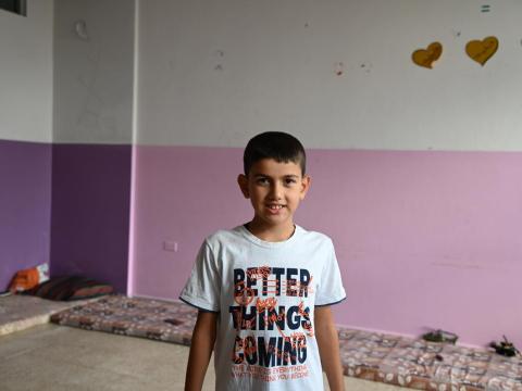 A child smiles for the camera in South Lebanon